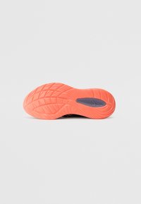 Rubber shoe sole in bright orange with textured tread patterns. Features a small blue accent near the center. Flat design for stability.