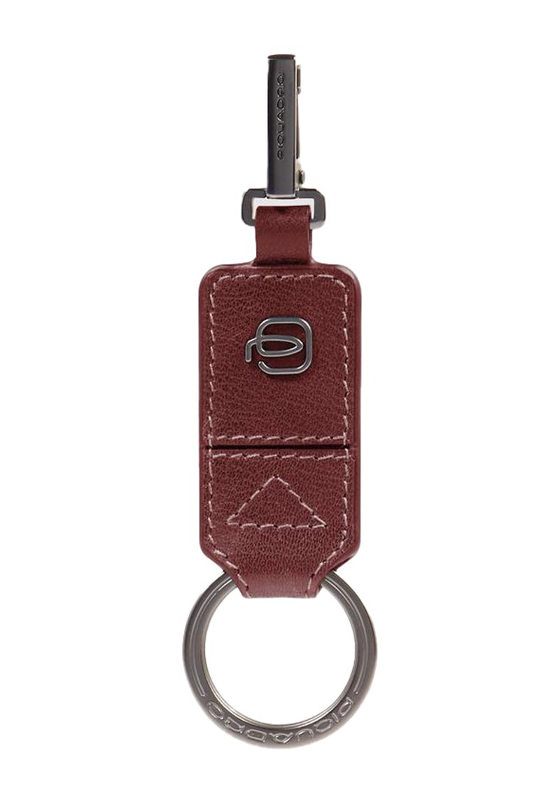 Burgundy leather keychain with a metal keyring, featuring a triangular stitch pattern and a prominent logo on the front.