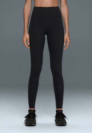 OYSHO, COMPRESSIVE RAISE UP HIGH-RISE ANKLE-LENGTH LEGGINGS - Pantalon classique - black