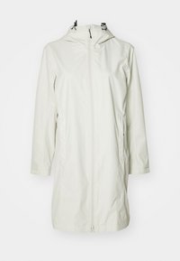Lett, vanntett jakke i lys beige. Har hette med snor, glidelås foran, og lange ermer. Enkel, strømlinjeformet design.