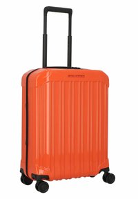 Orange hard-shell suitcase with vertical ridges, retractable black handle, and four rolling wheels for easy maneuverability.
