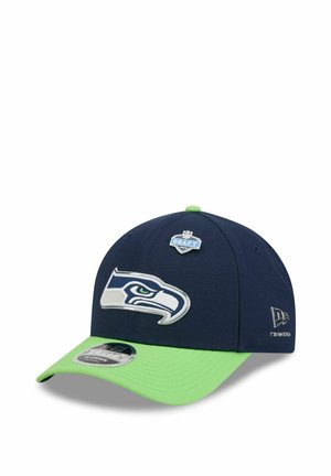 Seattle Seahawks navy and neon green baseball cap with team logo and NFL Draft 2023 emblem on front, New Era logo on side.