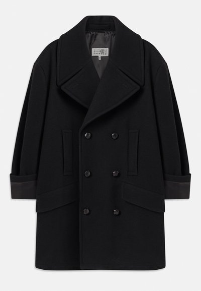 Double-breasted black coat in wool blend, featuring large lapels, two front pockets, and glossy black buttons, with leather accents on cuffs.