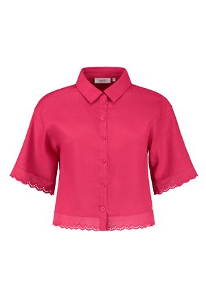 Short pink blouse with a collar, button front, and scalloped lace trim on sleeves and hem. Made from lightweight fabric.
