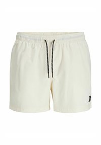 Pantaloni da bagno bianchi con un cinturino elastico, cordino nero e una piccola etichetta nera sul lato. Tessuto liscio e leggero.