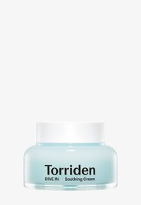 Vaaleansininen lasipurkki, jossa on valkoinen kansi. Purkin etiketissä lukee mustalla tekstillä "Torriden DIVE IN Soothing Cream". Pinnaltaan sileä ja muodoltaan pyöreä.