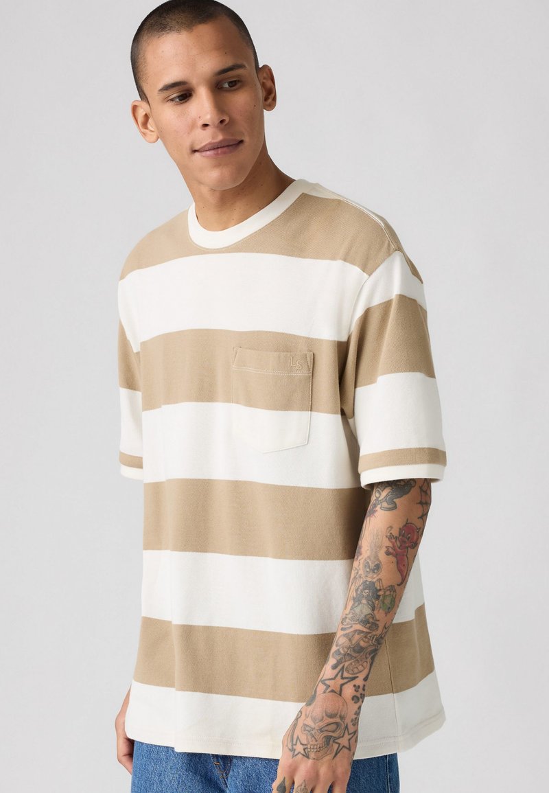 Beige and white striped short-sleeve shirt with a pocket, made of soft fabric, featuring a relaxed fit and ribbed crew neckline.