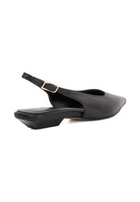 Black leather slingback shoe with pointed toe, low block heel, and adjustable strap featuring a gold-tone buckle. Smooth texture and sleek design.