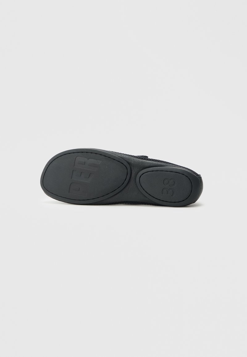 Black shoe sole with a textured grip, featuring a rounded shape, embossed size "38," and smooth edges. Made from rubber material.