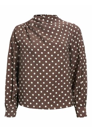 Bruine blouse met lange mouwen, voorzien van witte polkadots, licht gestructureerde stof, hoge halslijn en knoopsluitingen bij de manchetten.