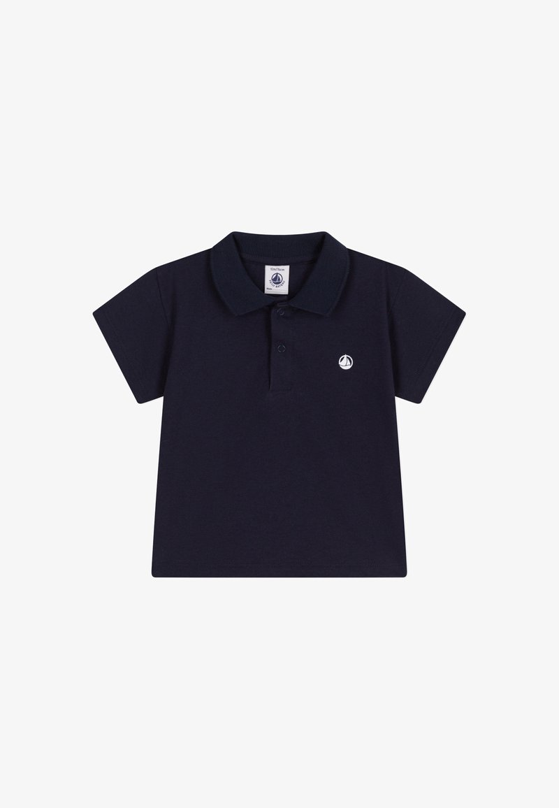 Polo bleu marine en coton. Doté d'un col classique, de manches courtes et d'un petit logo brodé sur la poitrine. Design simple.