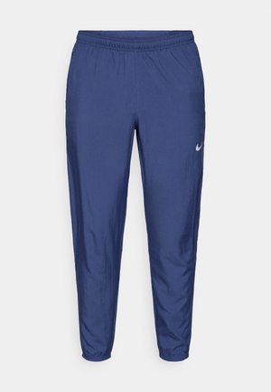 Marineblaue Sporthose mit elastischem Bund und Bündchen, schlanke Passform, mit kleinem weißen Nike-Swoosh-Logo am linken Oberschenkel.