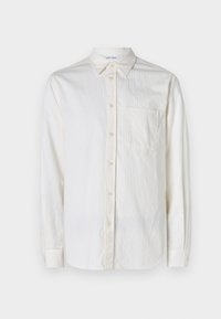 Long-sleeve, white shirt made of textured fabric with a button-down collar, front pocket, and button closures along the placket and cuffs.