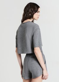 Calliope CROP EFFETTO LUMINESCENTE - T-shirt con stampa - grigio scuro melange