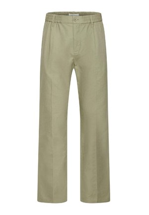 Pantalon large en lin de couleur kaki clair, doté d'une ceinture élastique et d'une fermeture à un bouton. Texture lisse, design minimaliste.