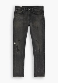 Vaqueros de mezclilla negros con un ajuste slim, que presentan áreas desgastadas, salpicaduras de pintura, diseño de cinco bolsillos y un cierre estándar de botón.