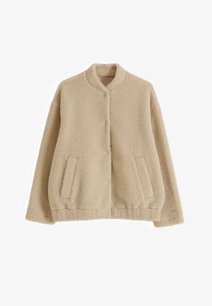 Beige sherpa fleecejakke med lange ærmer, stående krave, knaplukning, to forlommer og elastisk kant.