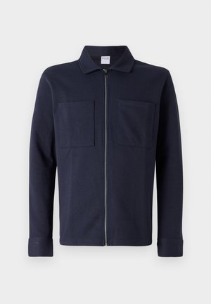 Navy blue zip-up jacket made of soft cotton, featuring a collared neckline and two front patch pockets. Smooth texture with long sleeves.