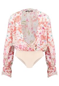 Body fleuri avec manches longues bouffantes, présentant un motif rose clair et vert sur tissu transparent, et un bas uni couleur nude.