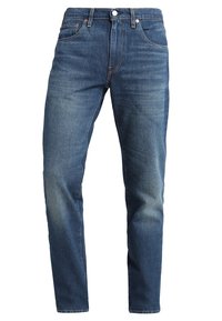 Pánské modré džíny z denimu s přímým střihem, pěti kapsami a vybledlým efektem. Mají kovové knoflíky a šicí detaily.