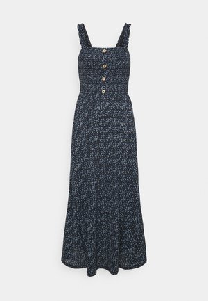 Marineblauwe mouwloze jurk met kleine bloemenprint, geplooide top met vier knopen aan de voorkant en gerimpelde schouderbandjes.