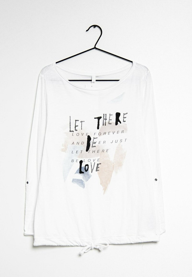 Witte lange mouwen shirt met een trekkoord onderrand. Bevat een zwart en pastelgekleurde tekstontwerp met de tekst "Laat de liefde er zijn." Zachte stofstructuur.