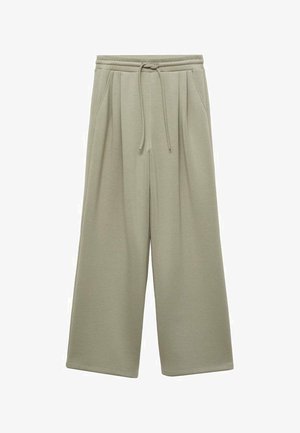 Pantalons de survêtement larges, de couleur vert clair, en tissu doux. Présente une taille avec cordon de serrage, des plis et une coupe décontractée. Pas de poches visibles.