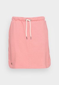 Saia atlética rosa claro com cintura elástica, cordão e bolsos laterais. Feita de um tecido macio e suave. Apresenta um pequeno detalhe de logótipo.