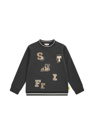 Felpa nera con maniche lunghe, collo rotondo e polsini a costine. Presenta toppe testurizzate e testo stampato in beige, inclusa la parola "DOWNHILL."