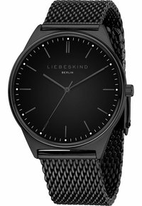 Zwarte mesh bandhorloge met een ronde wijzerplaat, minimalistisch ontwerp, zwarte dial, zilveren uurmarkeringen en een eenvoudige kroon. Merktekst weergegeven.