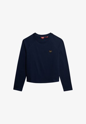 Camisa corta de manga larga de algodón azul marino con cuello redondo y mangas raglán; presenta un pequeño logo amarillo en el pecho.