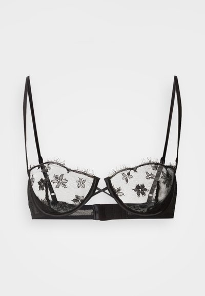 Juodo nėrinių liemenėlė su gėlių siuvinėjimu ant tinklelio kaušelių, turinti lygią apačią ir reguliuojamas petnešėles, užsegama kabliukais nugaroje.