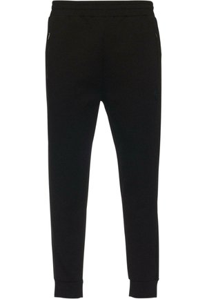 Czarne dresy wykonane z miękkiej tkaniny. Posiadają elastyczny pasek w talii, boczne kieszenie oraz zwężane nogawki z ribbed cuffs. Dyskretne logo.