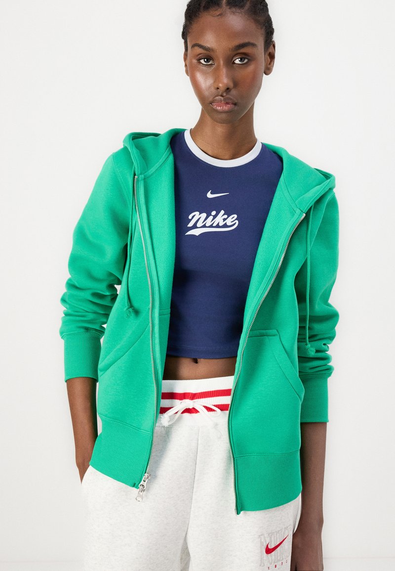 Petite Pantalon Cargo Vert Imprimé Camouflage À Boucle Sur L'avant