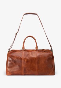 Brown leather duffel bag with dual handles, adjustable shoulder strap, and clean lines. Features minimal stitching and smooth texture.