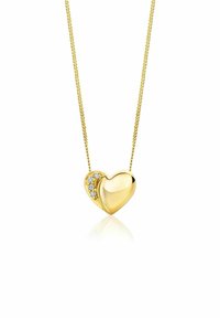 Collana con pendente a forma di cuore in oro, caratterizzata da una finitura lucida e un piccolo gruppo di tre pietre trasparenti su un lato; include una catena sottile.