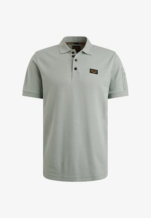 Jasnozielona koszulka polo wykonana z bawełny. Posiada plastron z trzema guzikami, małą naszywkę z logo na klatce piersiowej oraz krótkie rękawy. Gładka faktura.