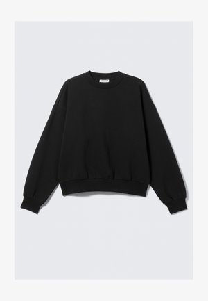 Sweatshirt noir à col rond avec des manches longues et des bords ribbed, posé à plat sur un fond clair.