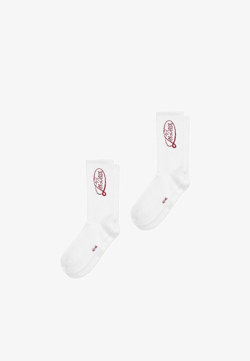 Paire de chaussettes blanches montantes avec logo rouge en écriture cursive « Lacatus » sur le mollet et taille 43-46 imprimée près des orteils.