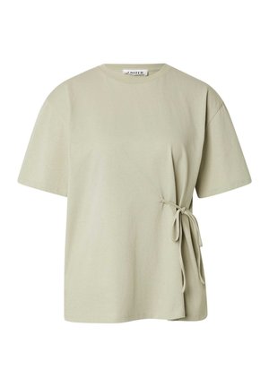 Light beige short-sleeve cotton T-shirt with a round neckline and a side tie detail on the right waist.