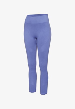 Middelhoge, vormgevende legging gemaakt van soepel, stretchy stof in een effen lavendel kleur. Heeft geen tailleband detail, met een naadloos ontwerp.