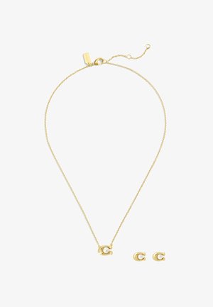 Ensemble de bijoux dorés comprenant un collier délicat avec une chaîne et un pendentif rond contenant une perle, ainsi que des boucles d'oreilles à puce en perle assorties.