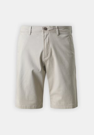 Pantalones cortos de algodón beige con un corte clásico, que cuentan con cremallera, cierre de botón y dos bolsillos laterales. Textura suave y diseño limpio.