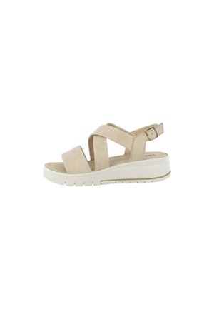 Sandalo beige da donna con cinturini incrociati, fibbia regolabile e suola zeppa bianca con fondo testurizzato antiscivolo.