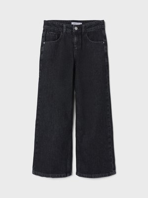 Sorte jeans med vide ben laget av denim. Har knappelukking, fem lommer og forsterkede sømmer. Materialet har en lett tekstur.