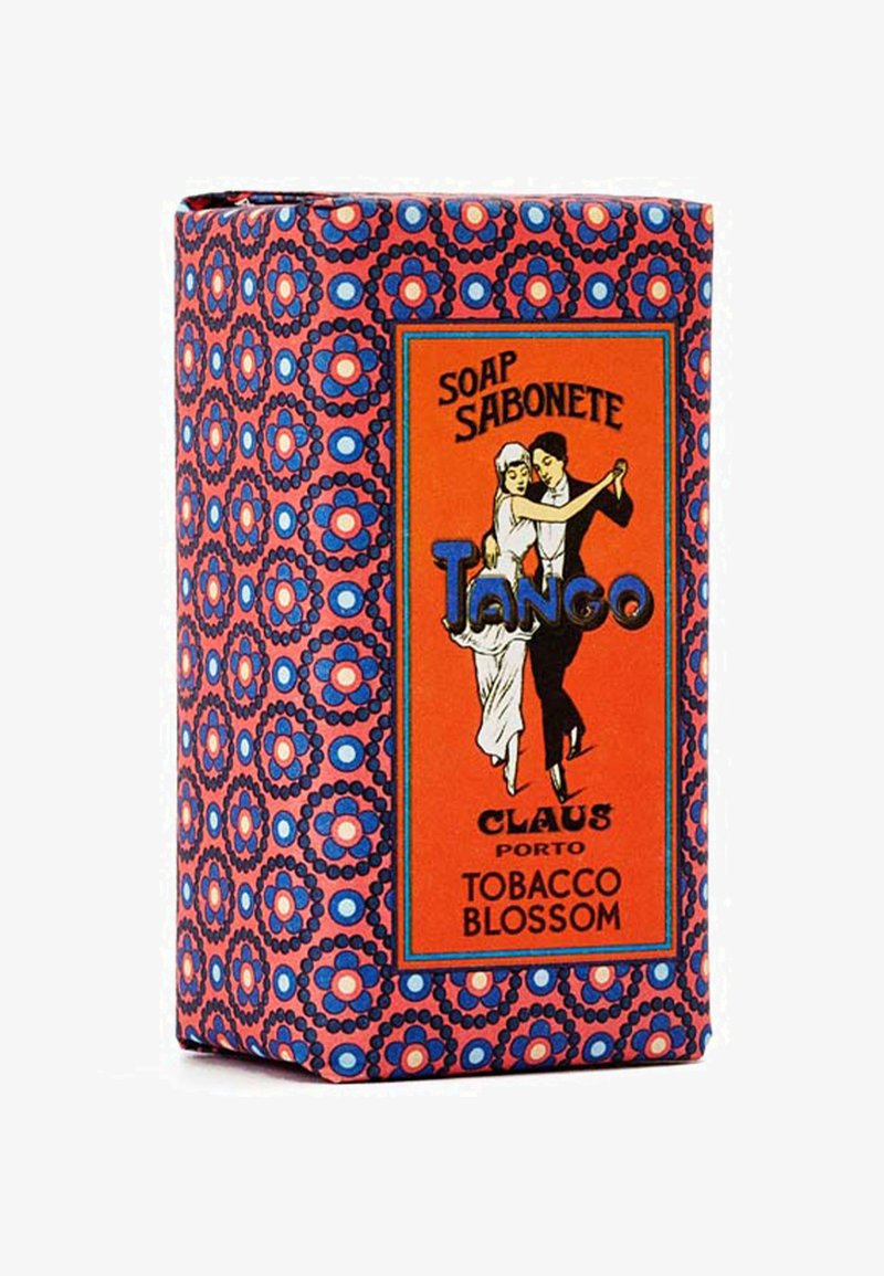 Die Verpackung des Seifenstücks hat ein lebendiges, gemustertes Design in Pink, Blau und Weiß, mit einem zentralen orangen Etikett für "Tango" und "Tobacco Blossom".