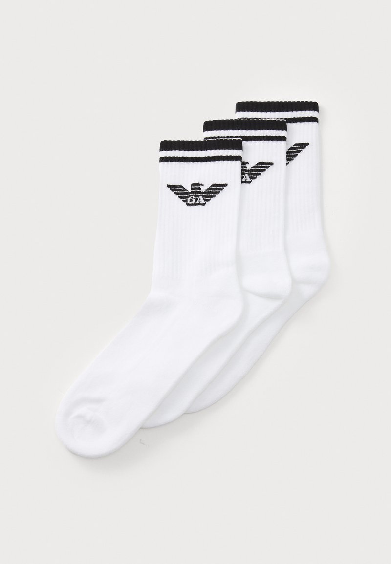 White athletic socks featuring black stripes at the top and a logo in the center. Fabric appears smooth with a classic crew length design.