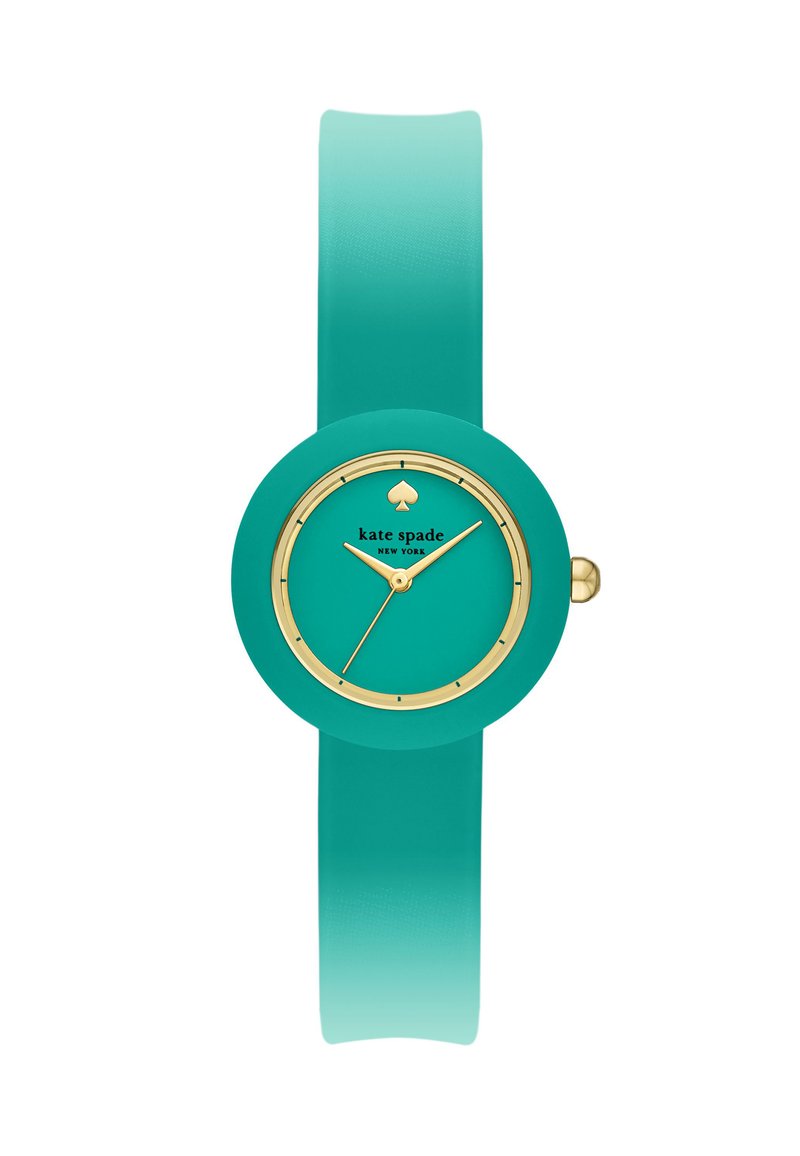 Tealfärgad silikonarmbandsur med rund urtavla, guldiga detaljer och en spade-logotyp. Slät yta och ombré-armband som övergår från teal till en ljusare nyans.