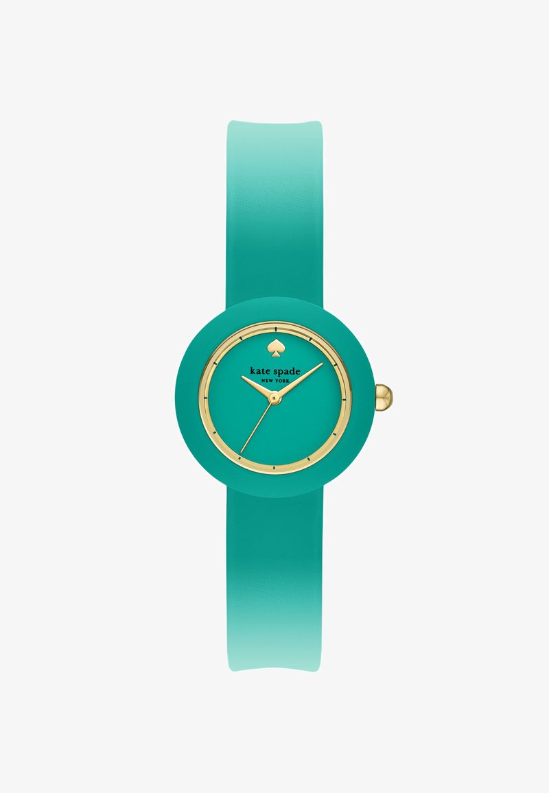 Tealfärgad silikonarmbandsur med rund urtavla, guldiga detaljer och en spade-logotyp. Slät yta och ombré-armband som övergår från teal till en ljusare nyans.