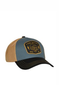 Gorra trucker azul y beige hecha de tela y malla, con un parche negro con bordado dorado de una calavera y rayos.